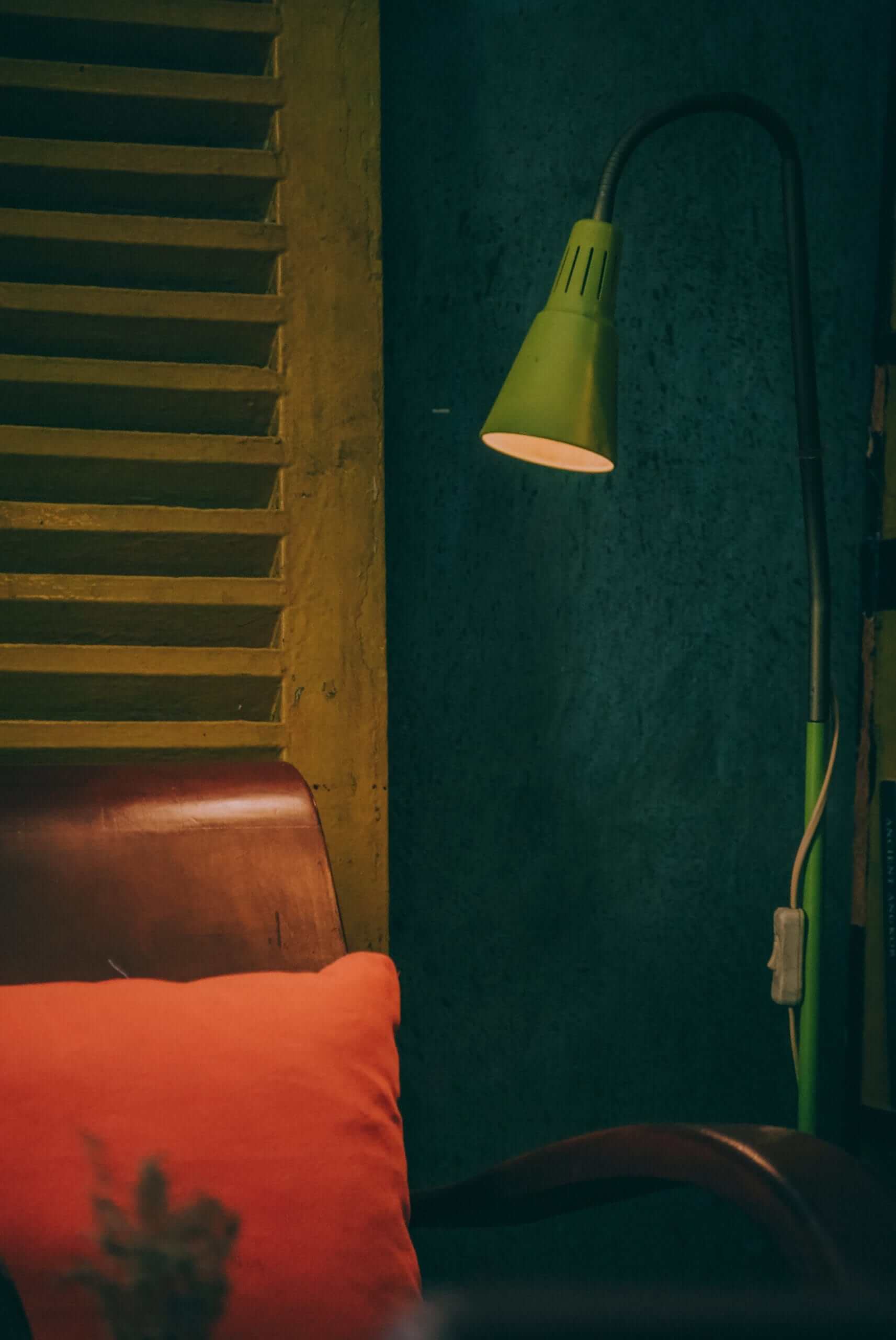 Green lamp near a chair